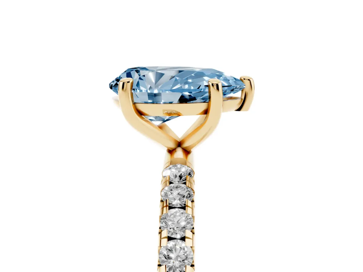Fancy Blue Pear Cut Cut Diamond Solitaire Ring with Micro Pave Band and Four Prong Setting Yellow gold