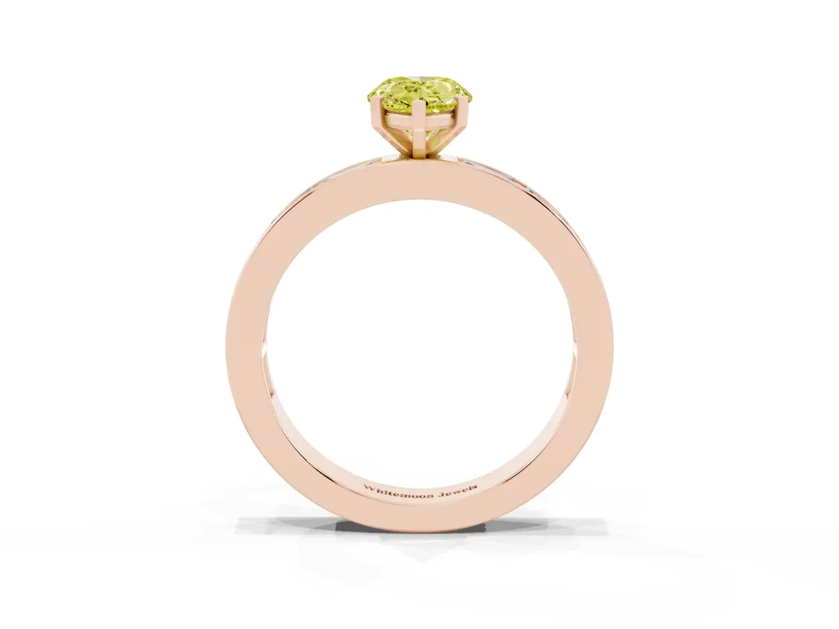 Fancy Yellow Pear Cut Solitaire Diamond Ring with Channel-Set Baguette Band and Four-Prong Setting Rose gold