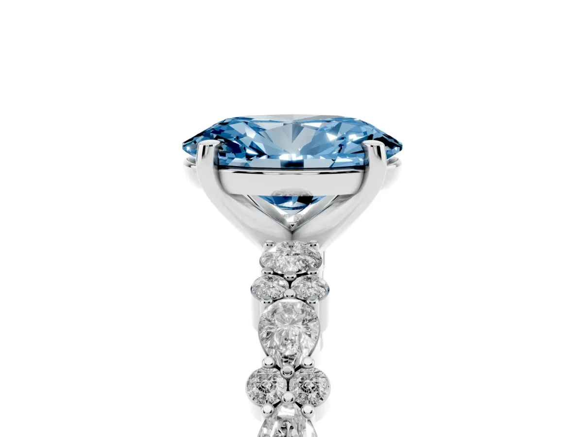 Fancy Blue Oval Cut Diamond Side Stone Solitaire Ring with Round and Four-Prong Setting Silver