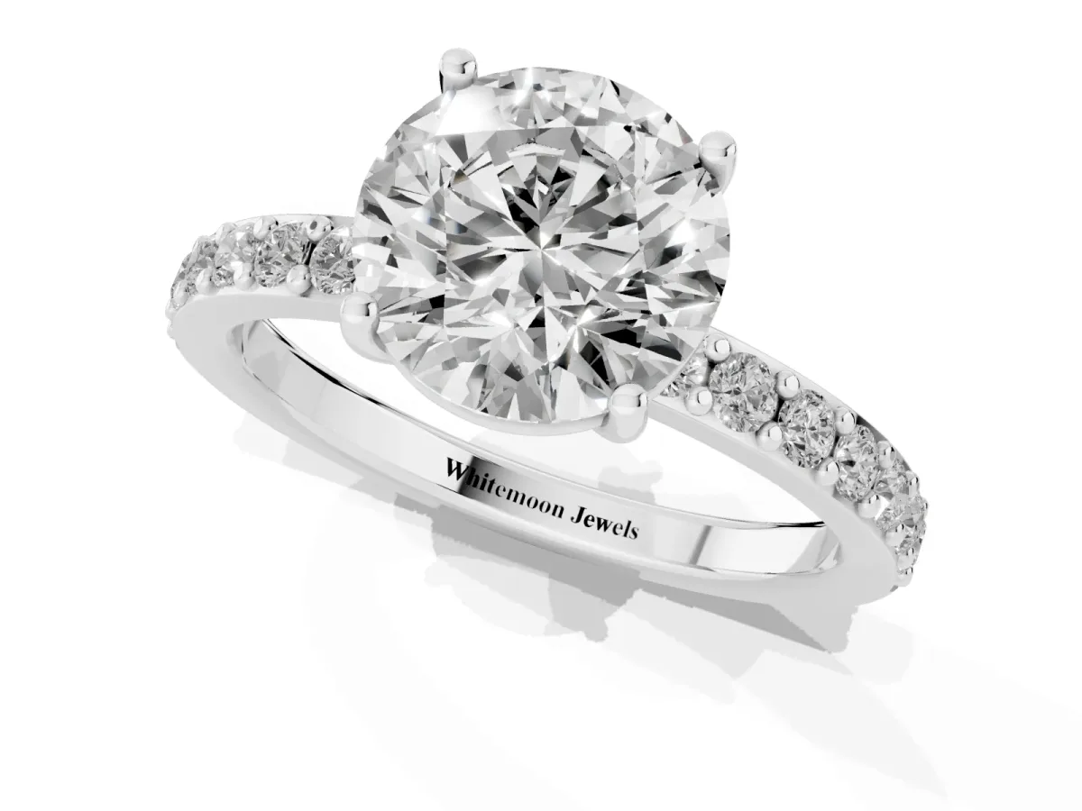 Round Cut Cut Diamond Solitaire with Pave Band and Four-Prong Setting Silver