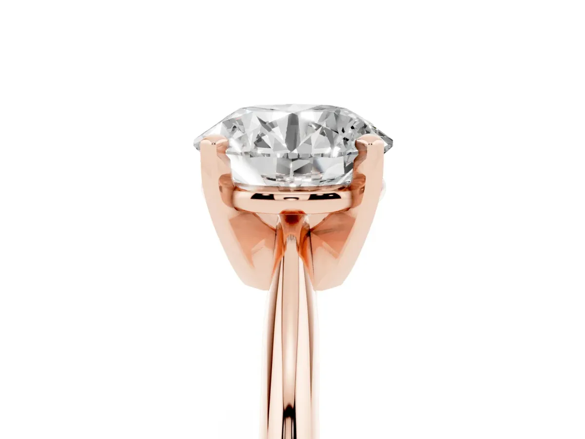 Round Cut Cut Solitaire Ring with Four-Prong Setting on a Classic Band Rose gold