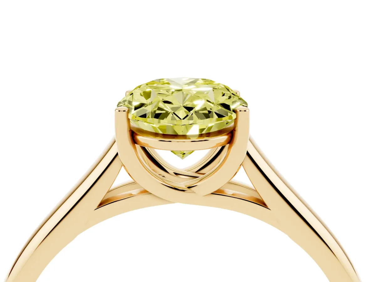 Fancy Yellow Oval Cut Solitaire Engagement Ring with Tapered Band and Four-Prong Setting Yellow gold