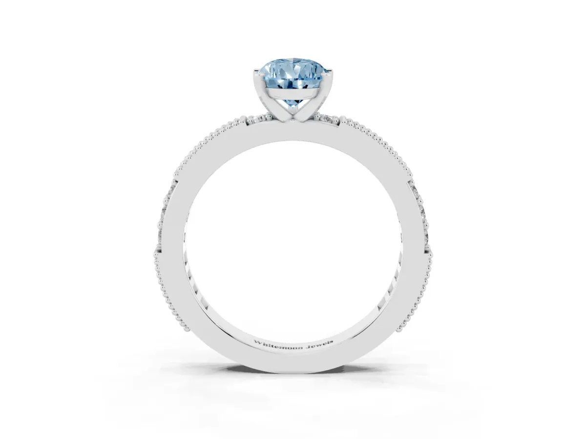 Fancy Blue Pear Cut Solitaire with Pavé Band and Four-Prong Setting Platinum