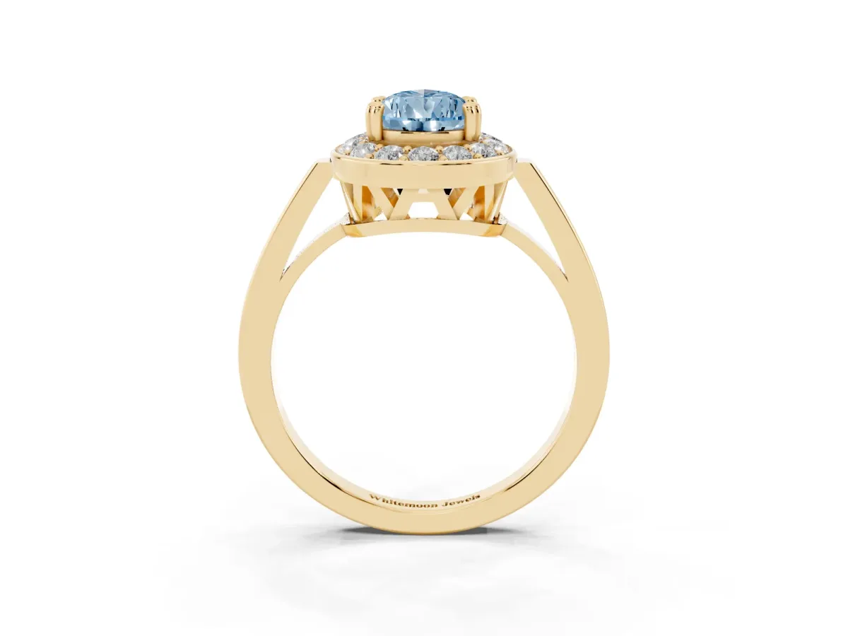 Fancy Blue Pear Cut Diamond Halo Ring with Split Shank and Four-Prong Setting Yellow gold