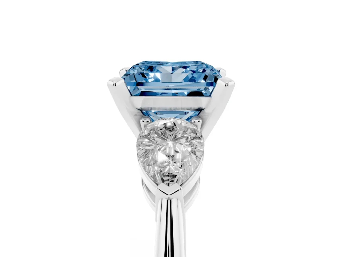 Fancy Blue Three-Stone Princess Cut Diamond Ring with Pear Side Stones and Four-Prong Setting Platinum