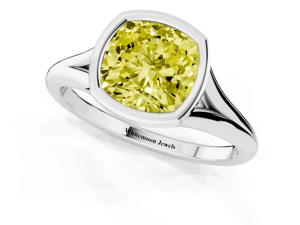 Fancy Yellow Bezel Set Cushion Cut Cut Solitaire Ring with Tapered Band White gold
