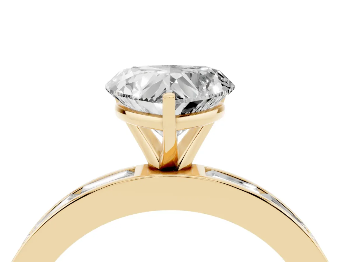 Heart Cut Solitaire Diamond Ring with Channel-Set Baguette Band and Four-Prong Setting Yellow gold