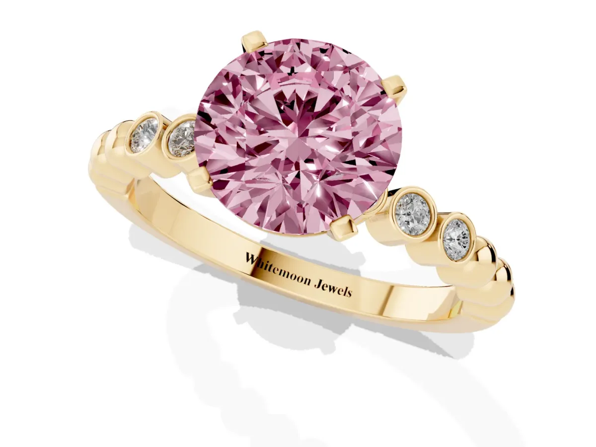 Fancy Pink Round Cut Solitaire Bezel Accent Diamond Engagement Ring with Beaded Band and Four-Prong Setting Yellow gold