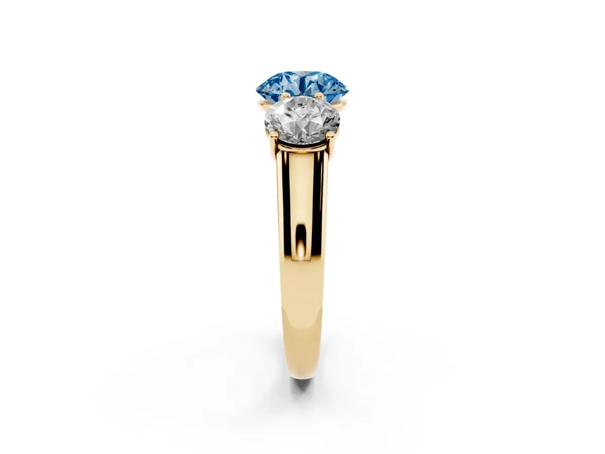 Fancy Blue Round Cut Three-Stone Diamond Ring with Prong Setting on a Classic Band Yellow gold
