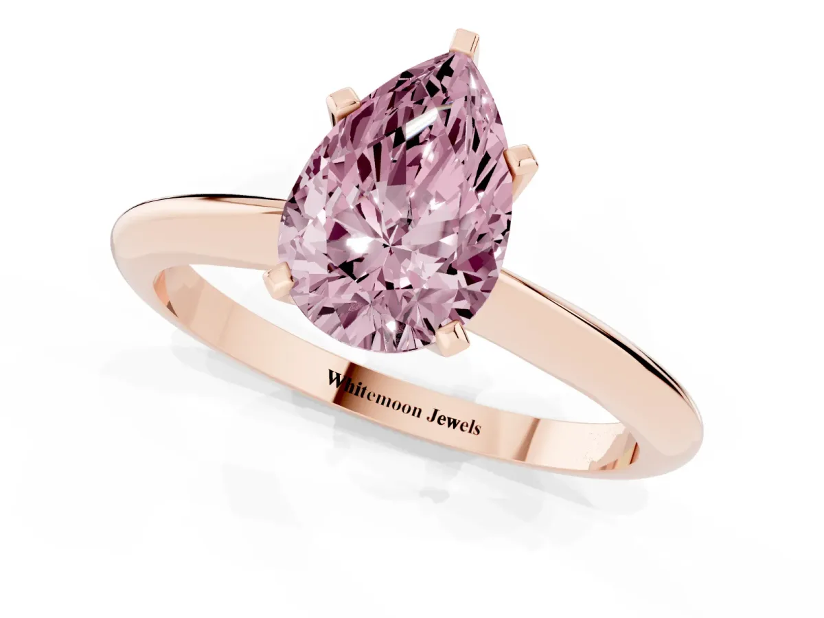 Fancy Pink Pear Cut Cut Solitaire Ring with Four-Prong Setting on a Classic Band Rose gold