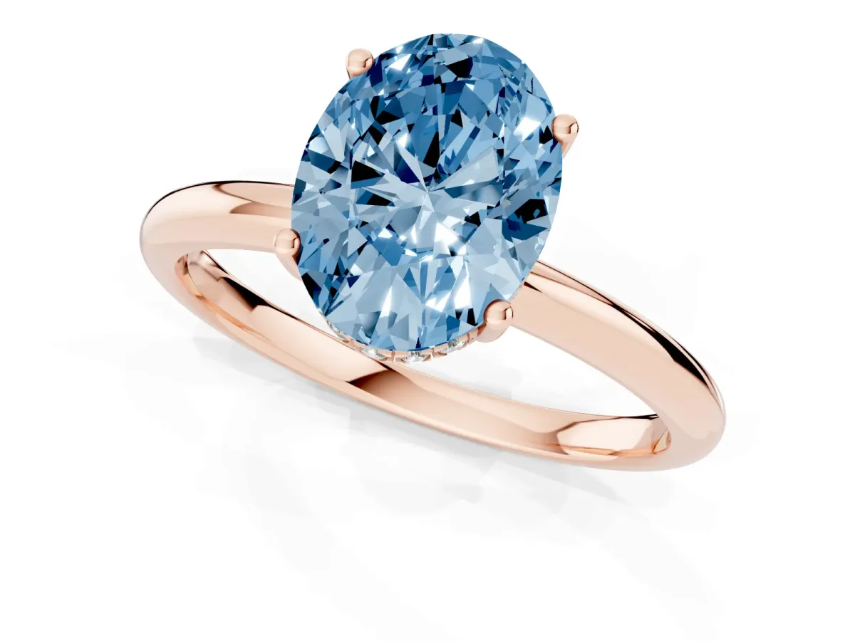Fancy Blue Oval Cut Cut Solitaire Engagement Ring with Four-Prong Setting and Classic Band Rose gold