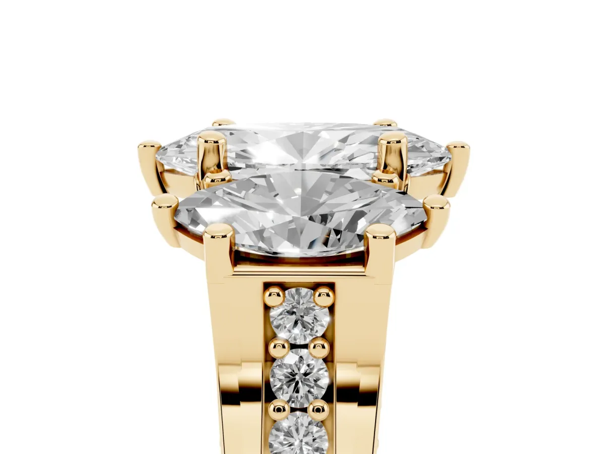 Marquise Cut Diamond Three-Stone Ring with Channel Set Band and Four-Prong Setting Yellow gold