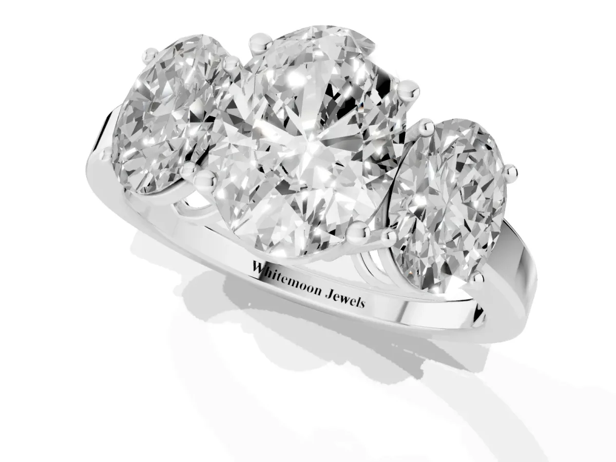Three-Stone Oval Cut Cut Diamond Engagement Ring with Flat Band and Four-Prong Setting Silver
