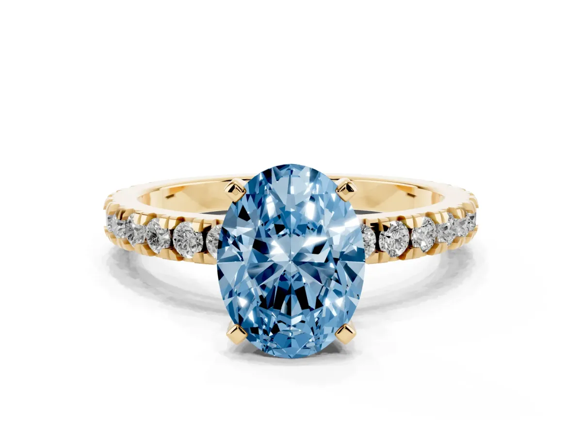 Fancy Blue Oval Cut Diamond Pavé Band Solitaire with Four-Prong Setting Yellow gold