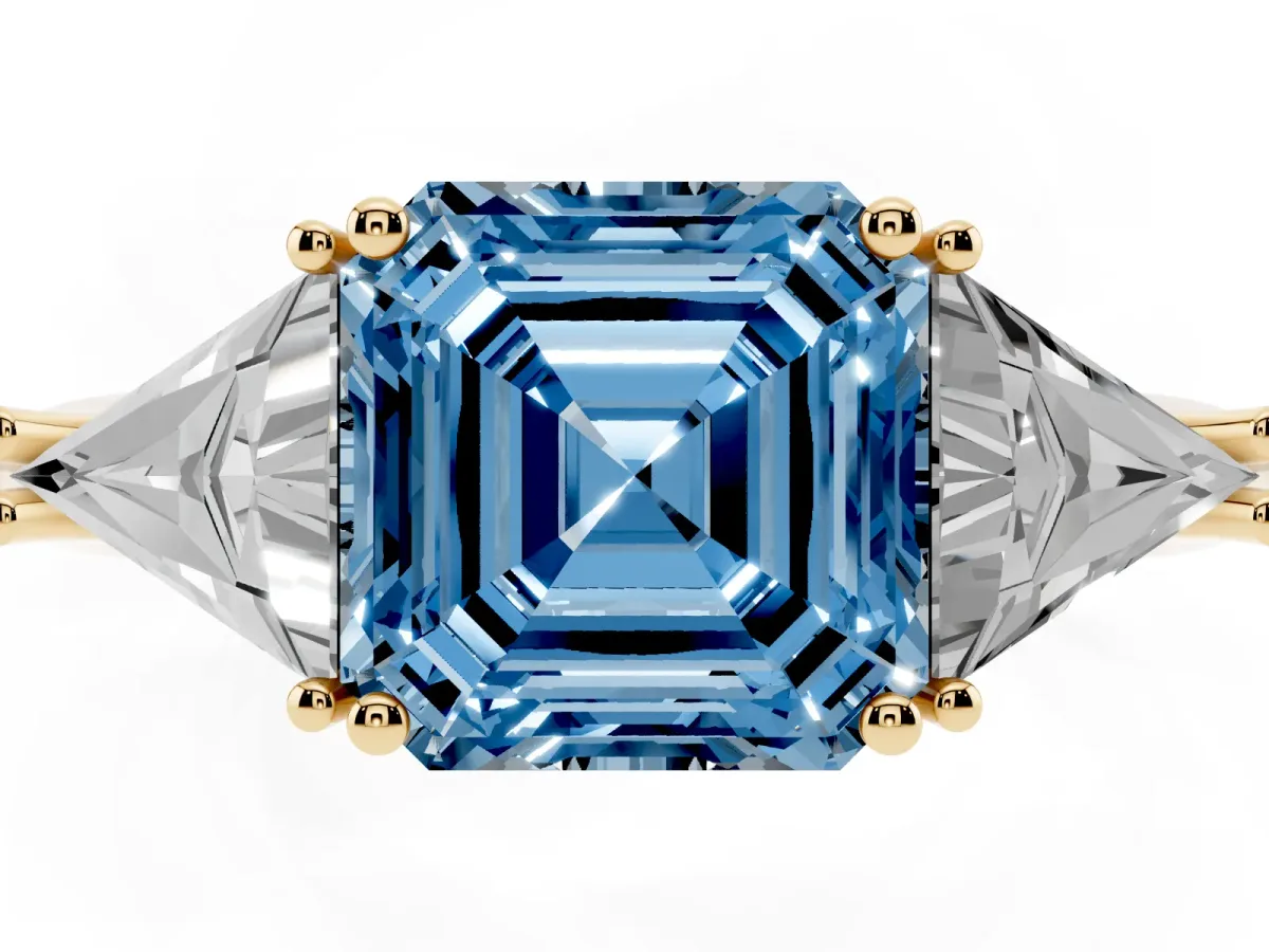 Fancy Blue Three-Stone Asscher Cut Diamond Engagement Ring with Trillion Side Stones and Prong Setting Yellow gold