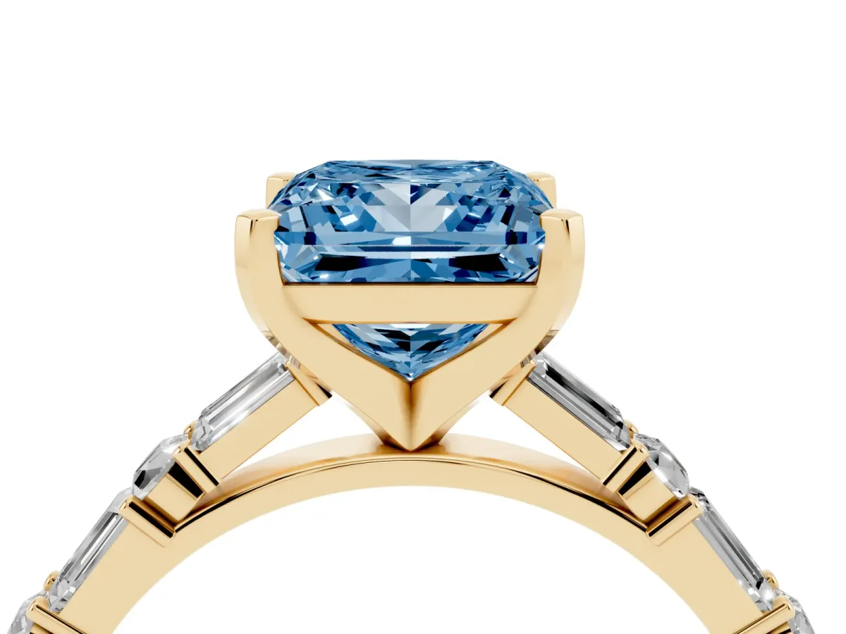 Fancy Blue Princess Cut Diamond Solitaire with Side Baguettes and Channel Set Band Yellow gold