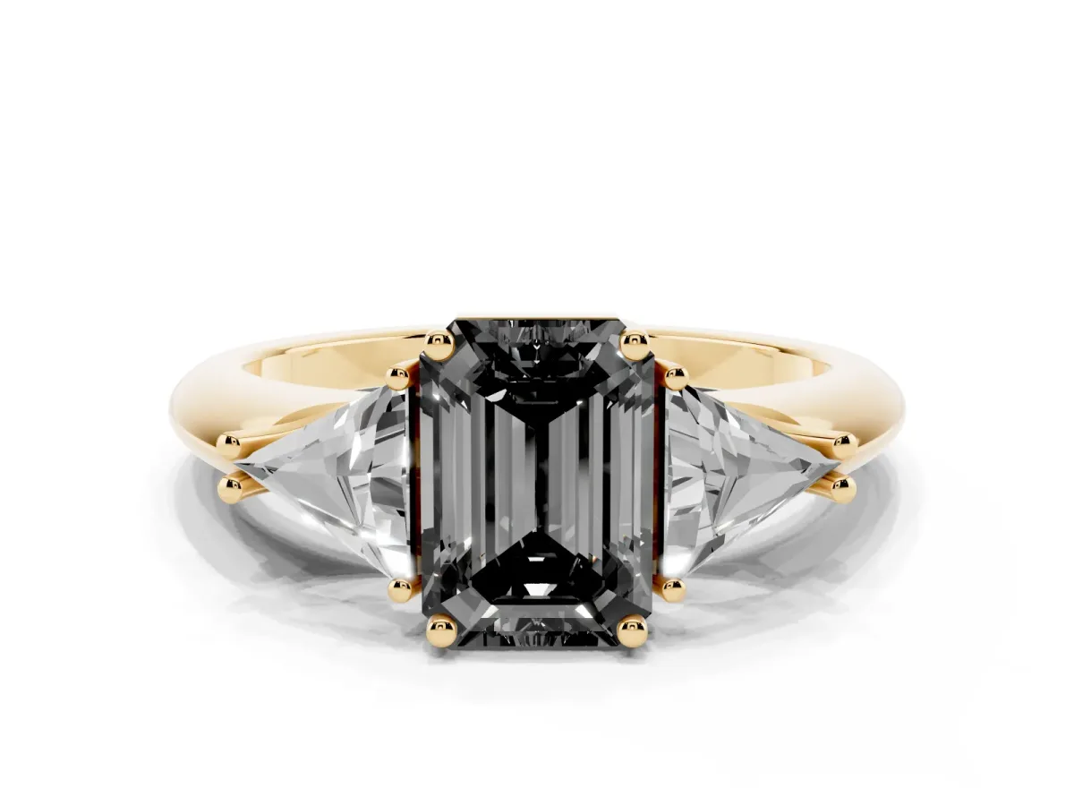 Fancy Black Three-Stone Emerald Cut Diamond Engagement Ring with Trillion Side Stones and Prong Setting Yellow gold