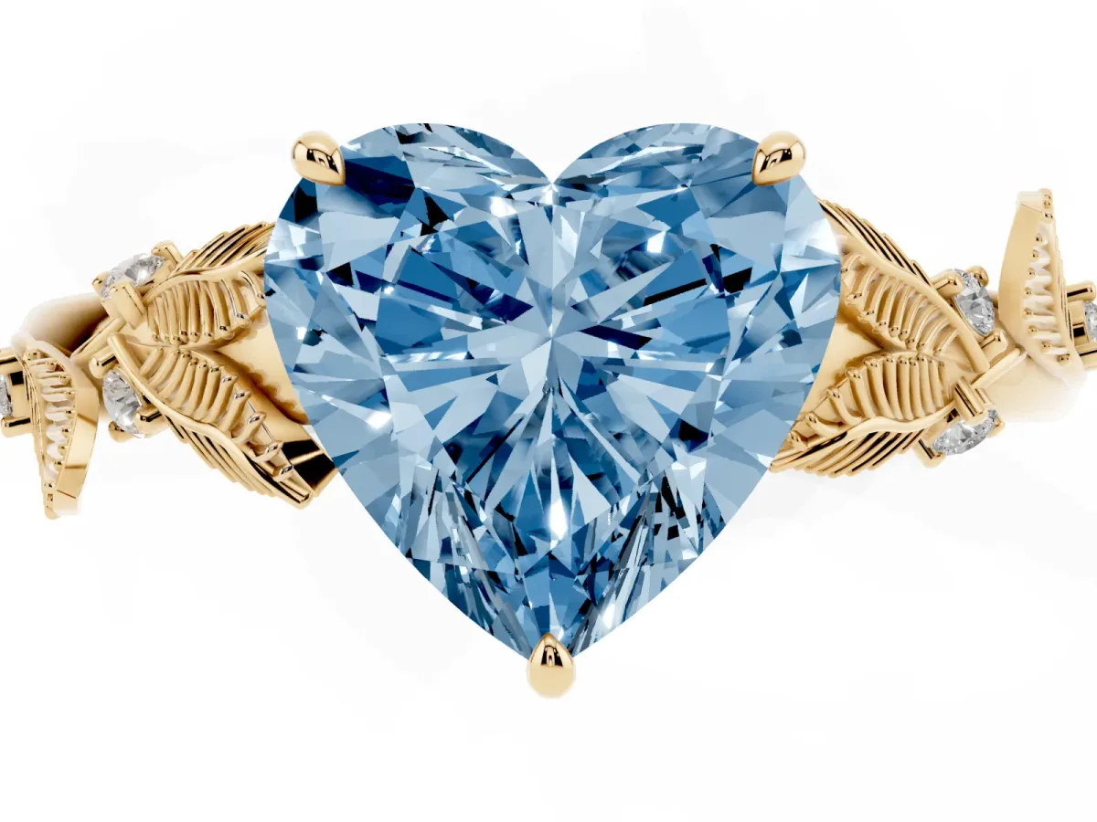 Fancy Blue Heart Cut Diamond Solitaire Ring with Leaf Motif Band and Four-Prong Setting Yellow gold
