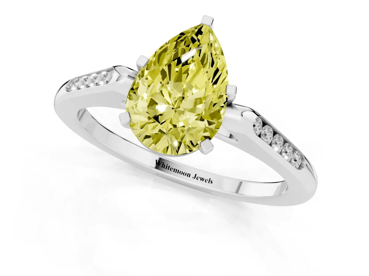 Fancy Yellow Pear Cut Diamond Solitaire Ring with Channel Set Round Band and Prong Setting Silver