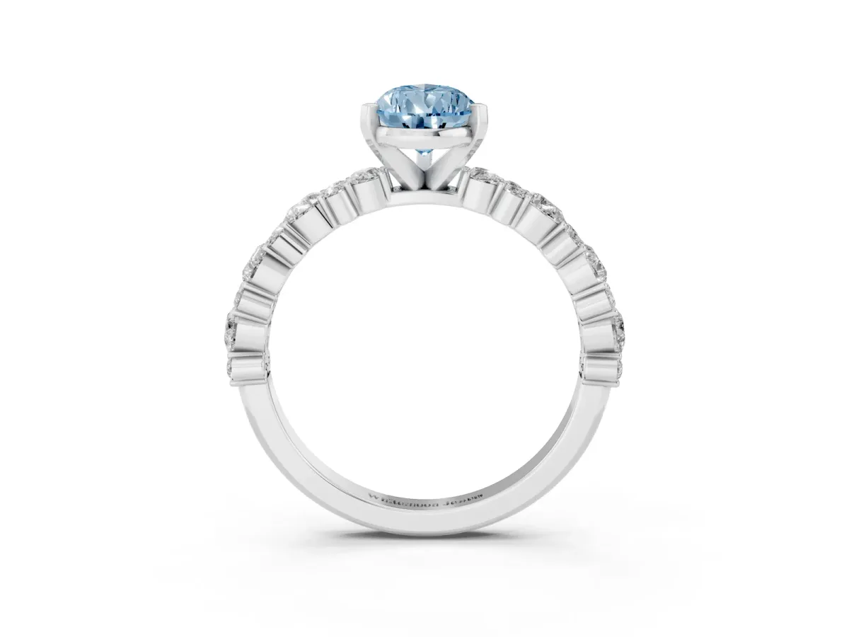 Fancy Blue Pear Cut Diamond Side Stone Solitaire Ring with Round and Four-Prong Setting White gold