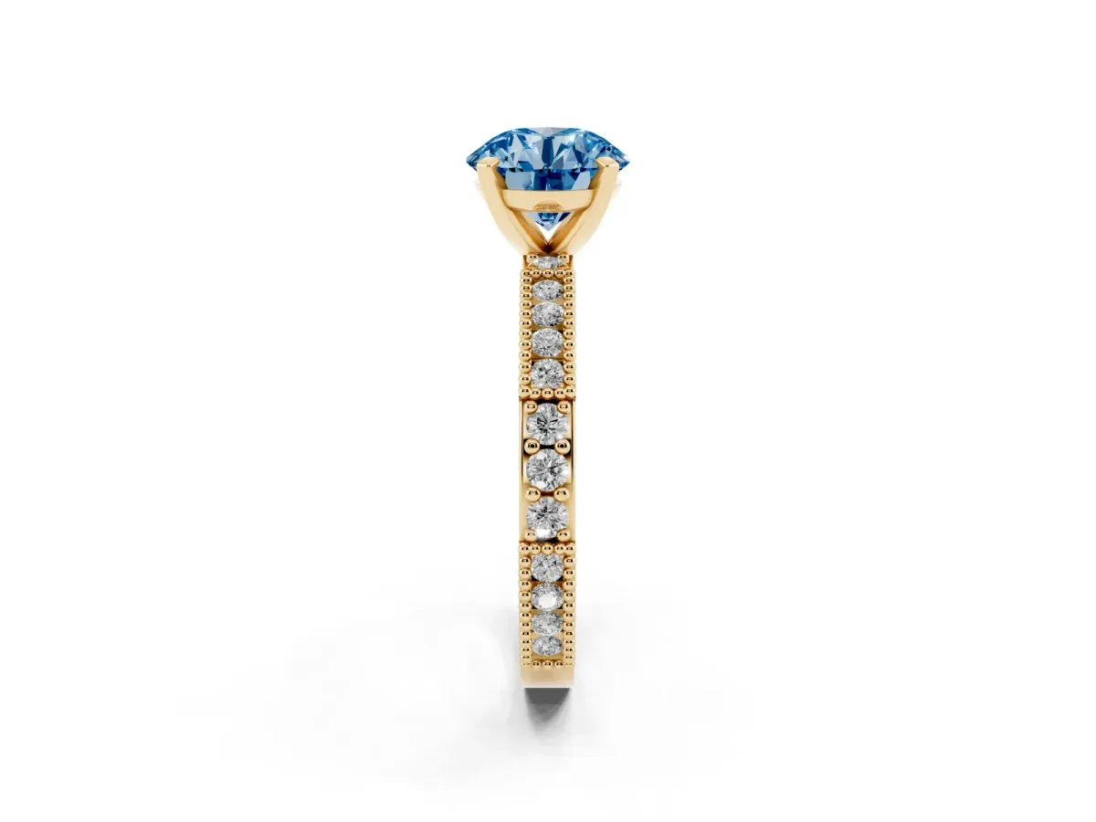 Fancy Blue Round Cut Solitaire with Pavé Band and Four-Prong Setting Yellow gold