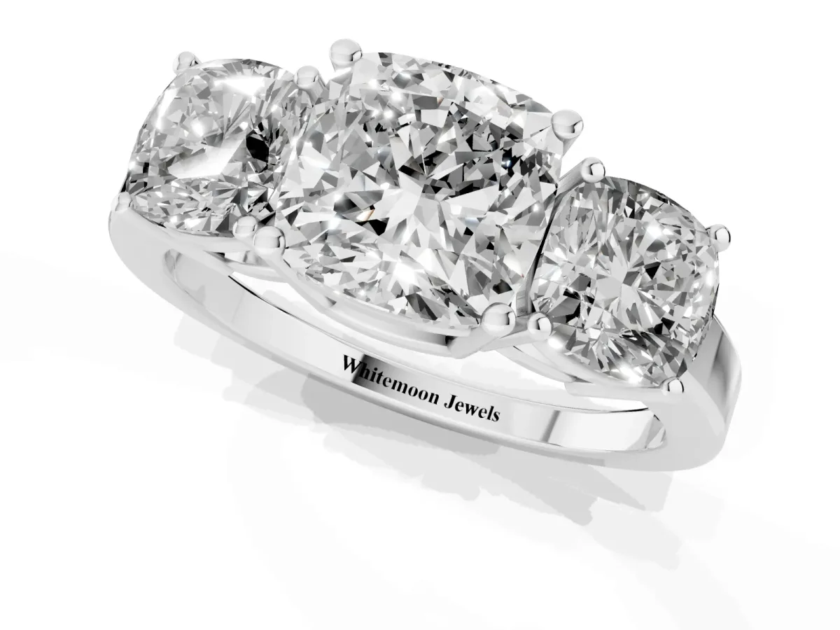 Three-Stone Cushion Cut Cut Diamond Engagement Ring with Flat Band and Four-Prong Setting Silver