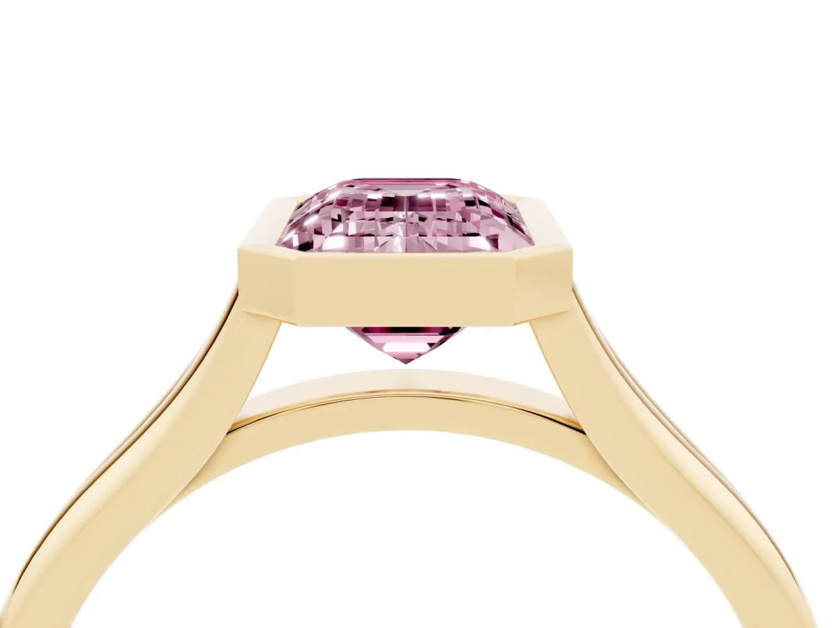 Fancy Pink Bezel Set Emerald Cut Cut Solitaire Ring with Tapered Band Yellow gold