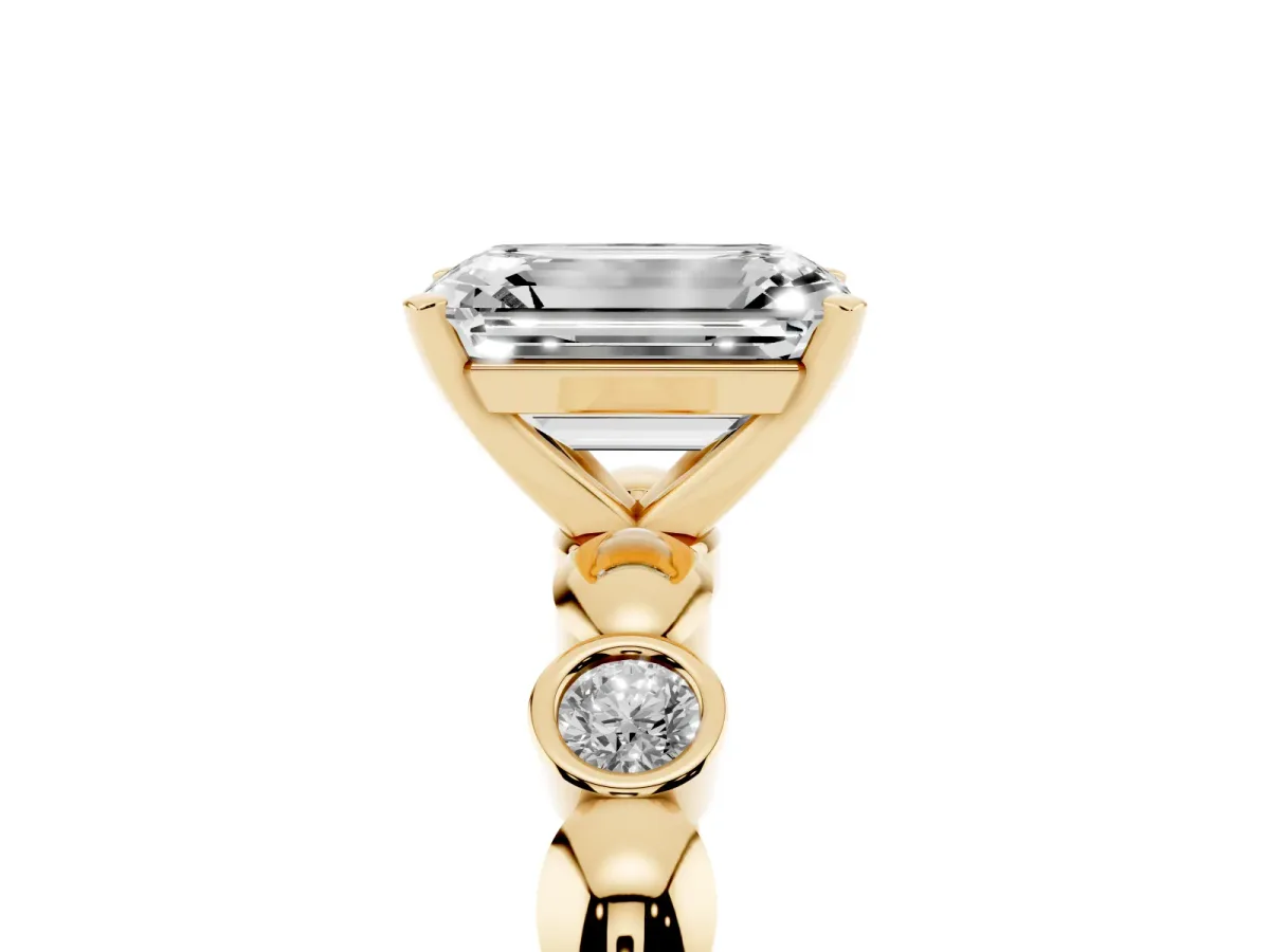 Emerald Cut Solitaire Bezel-Set Diamond Ring with Beaded Band and Four-Prong Setting Yellow gold