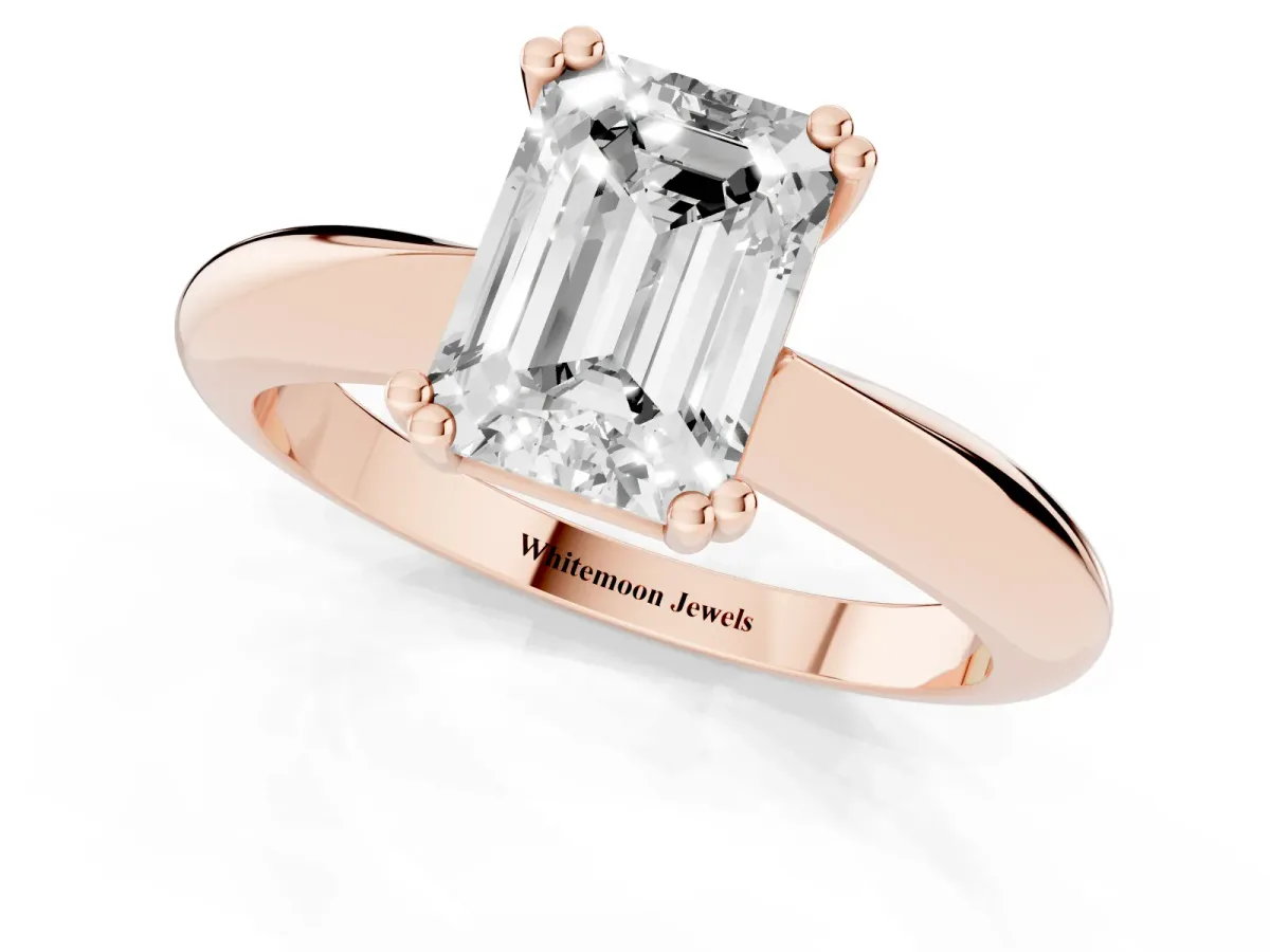 Emerald Cut Cut Solitaire Engagement Ring with Tapered Band and Four-Prong Setting Rose gold