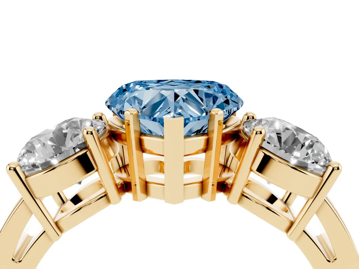 Fancy Blue Three-Stone Heart Cut Diamond Ring with Round Side Stones, Classic Band, and Four-Prong Setting Yellow gold