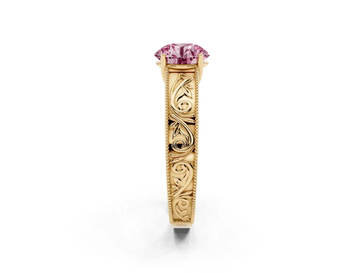 Fancy Pink Round Cut Diamond Solitaire Ring with Engraved Band and Four-Prong Setting Yellow gold