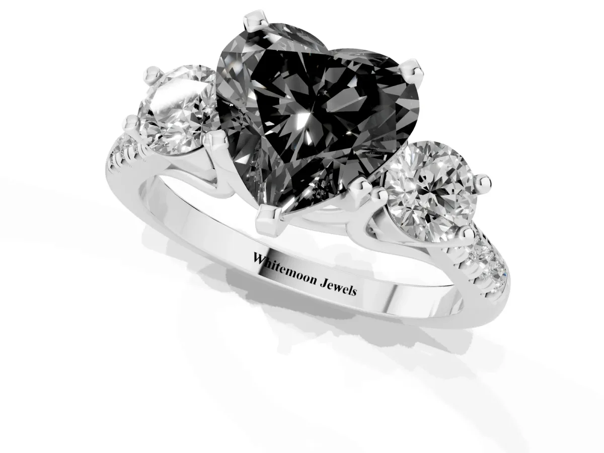 Fancy Black Three-Stone Heart Cut Diamond Pavé Band with Four-Prong Setting Platinum