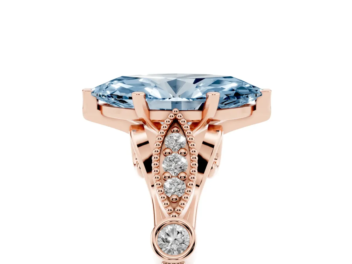 Fancy Blue Marquise Cut Cut Diamond with Milgrain Marquise and Bezel Accents on a Solitaire Band with Prong Setting Rose gold