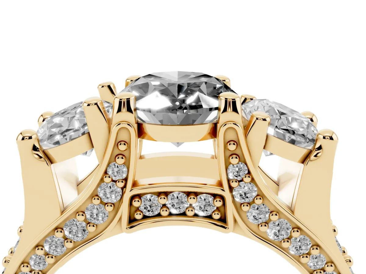 Fancy Black Oval Cut Diamond Three-Stone Ring with Channel Set Band and Four-Prong Setting Yellow gold