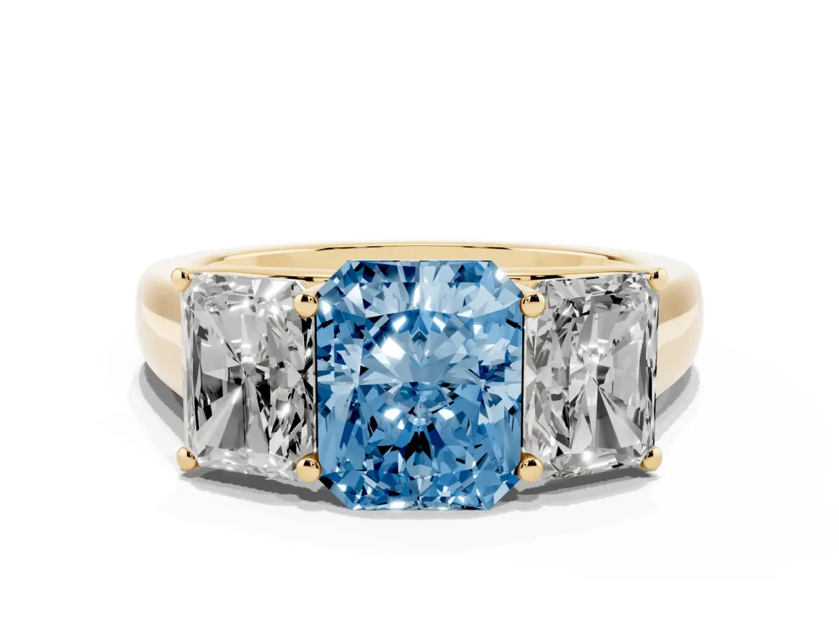 Fancy Blue Radiant Cut Three-Stone Diamond Ring with Prong Setting on a Classic Band Yellow gold