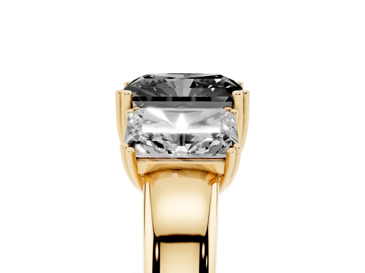 Fancy Black Three-Stone Radiant Cut Cut Diamond Ring with Channel Set Band and Four-Prong Setting Yellow gold