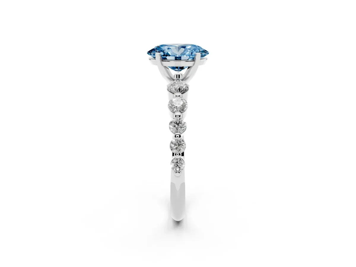 Fancy Blue Oval Cut Solitaire Diamond Ring with Pave Band and Four-Prong Setting Silver