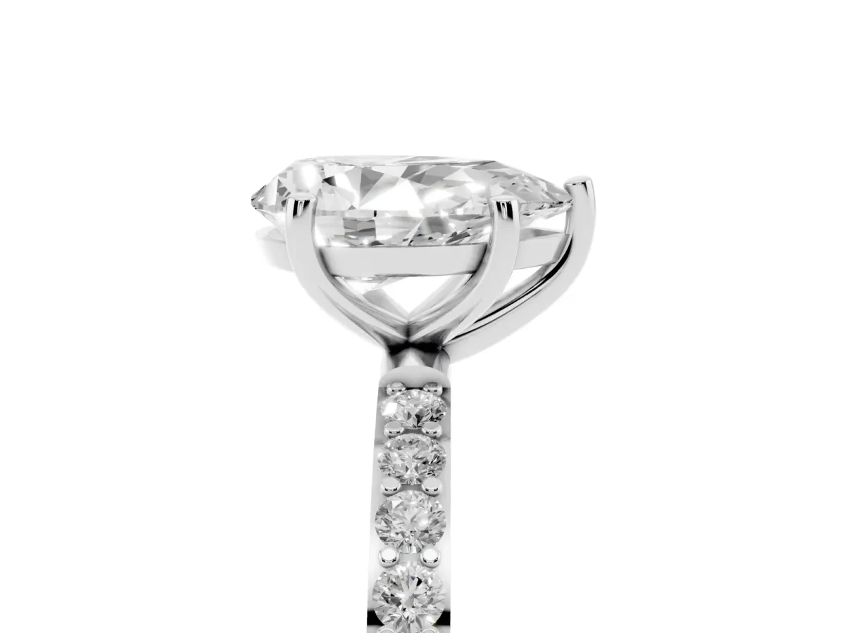 Pear Cut Diamond Solitaire Ring with Round Pavé Shoulders and Prong Setting Platinum