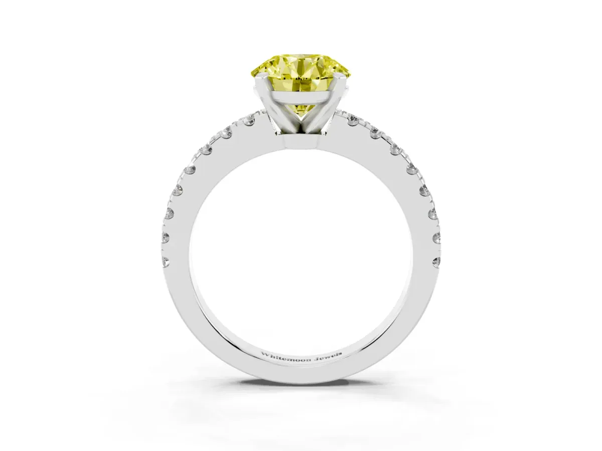 Fancy Yellow Round Cut Solitaire Diamond with Pavé Band and Four-Prong Setting Platinum