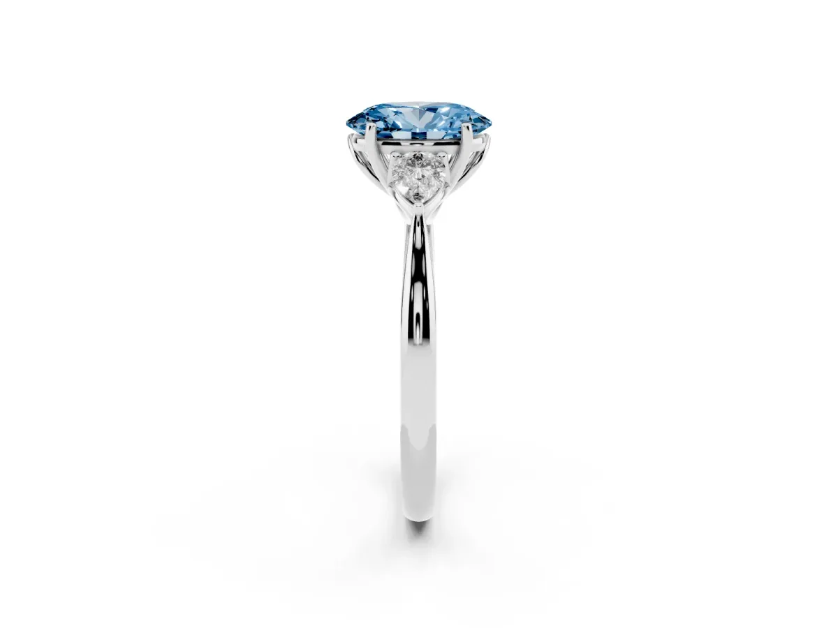 Fancy Blue Three-Stone Oval Cut Brilliant Diamond Solitaire Ring with Tapered Band and Four-Prong Setting Platinum