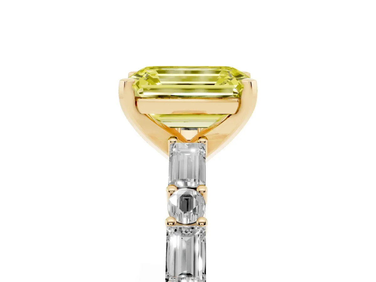 Fancy Yellow Emerald Cut Diamond Solitaire with Side Baguettes and Channel Set Band Yellow gold