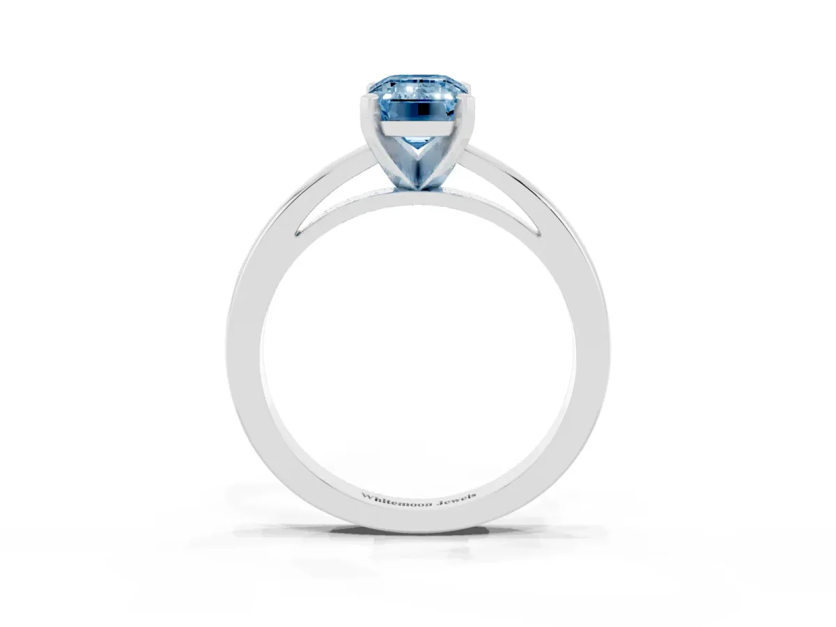 Fancy Blue Emerald Cut Solitaire Diamond Engagement Ring with Four-Prong Setting on a Classic Band Silver