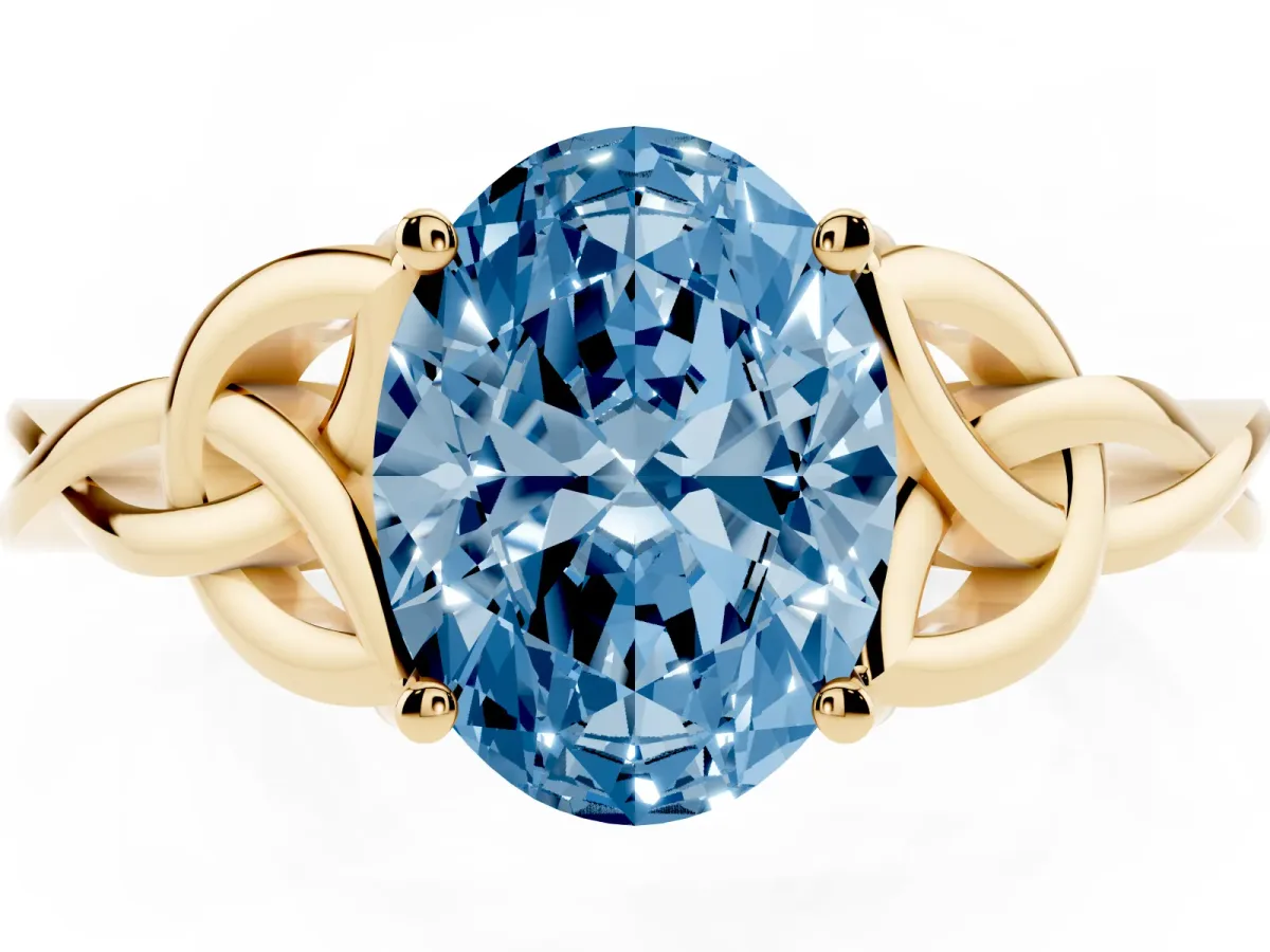 Fancy Blue Oval Cut Diamond Solitaire Engagement Ring with Celtic Knot Band and Four-Prong Setting Yellow gold