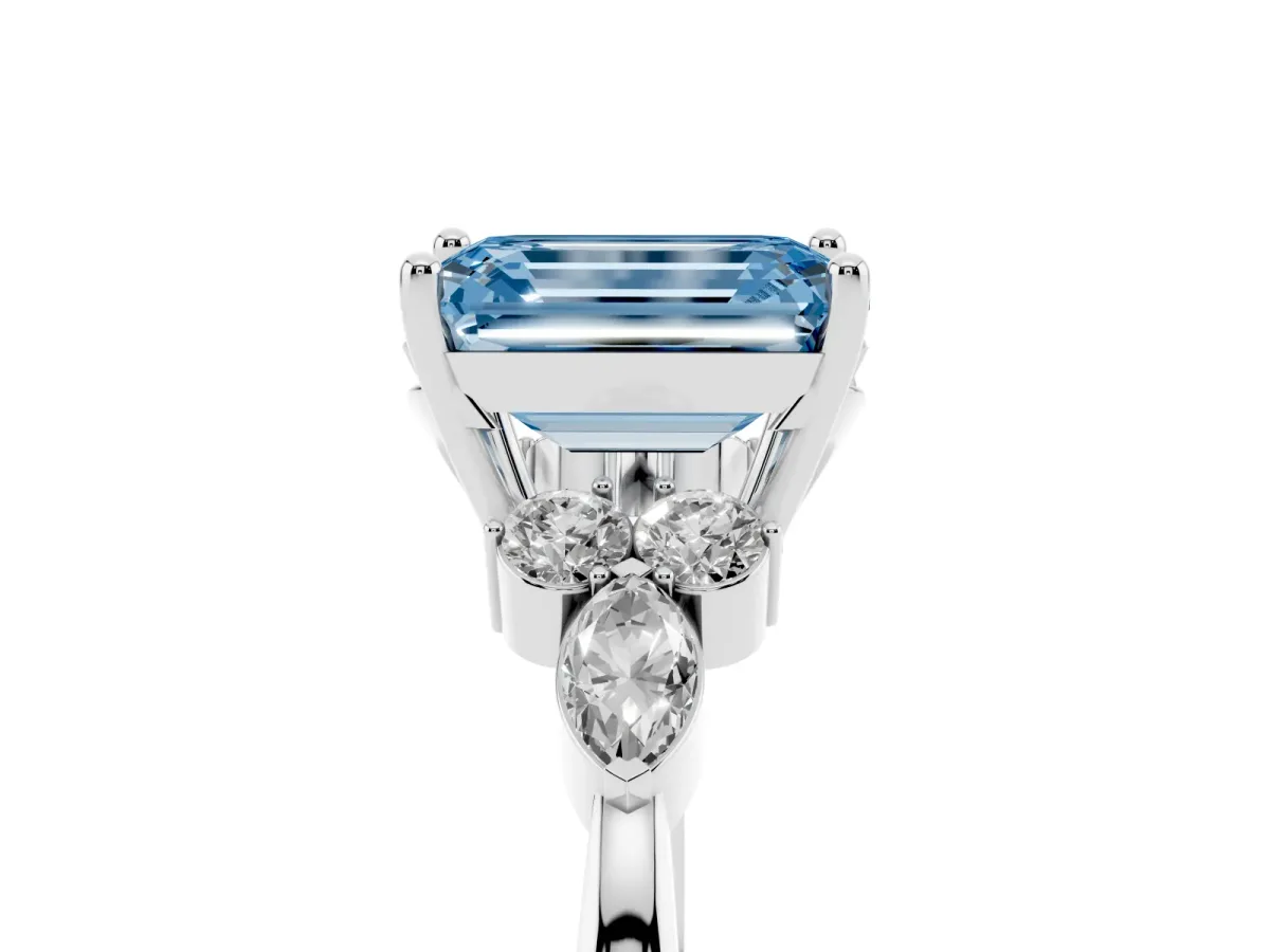 Fancy Blue Emerald Cut Brilliant Diamond Solitaire Ring with Pear Side Stones and Four-Prong Setting Silver