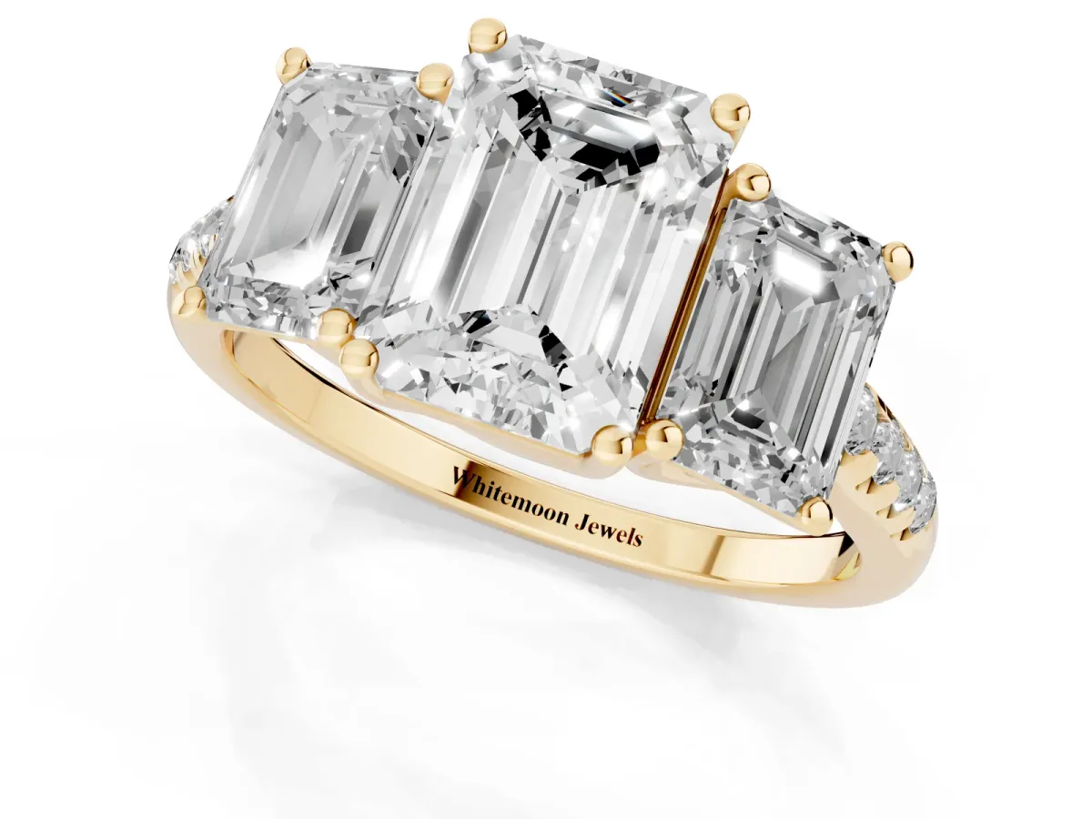Three-Stone Emerald Cut Diamond Ring with Round Pavé Band and Prong Setting Yellow gold