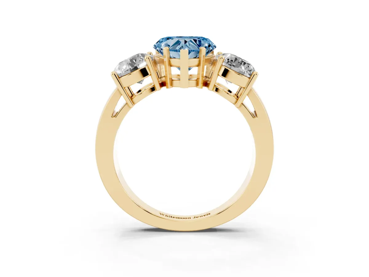 Fancy Blue Three-Stone Heart Cut Diamond Ring with Round Side Stones, Classic Band, and Four-Prong Setting Yellow gold