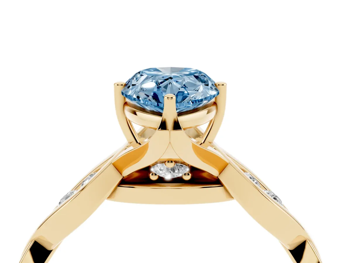 Fancy Blue Pear Cut Solitaire Twist Band with Leaf Prong Setting Yellow gold