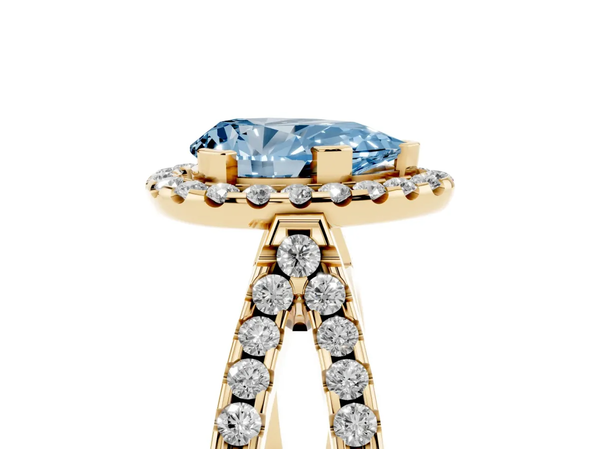 Fancy Blue Pear Cut Diamond Halo Ring with Split Shank Pavé Band and Prong Setting Yellow gold