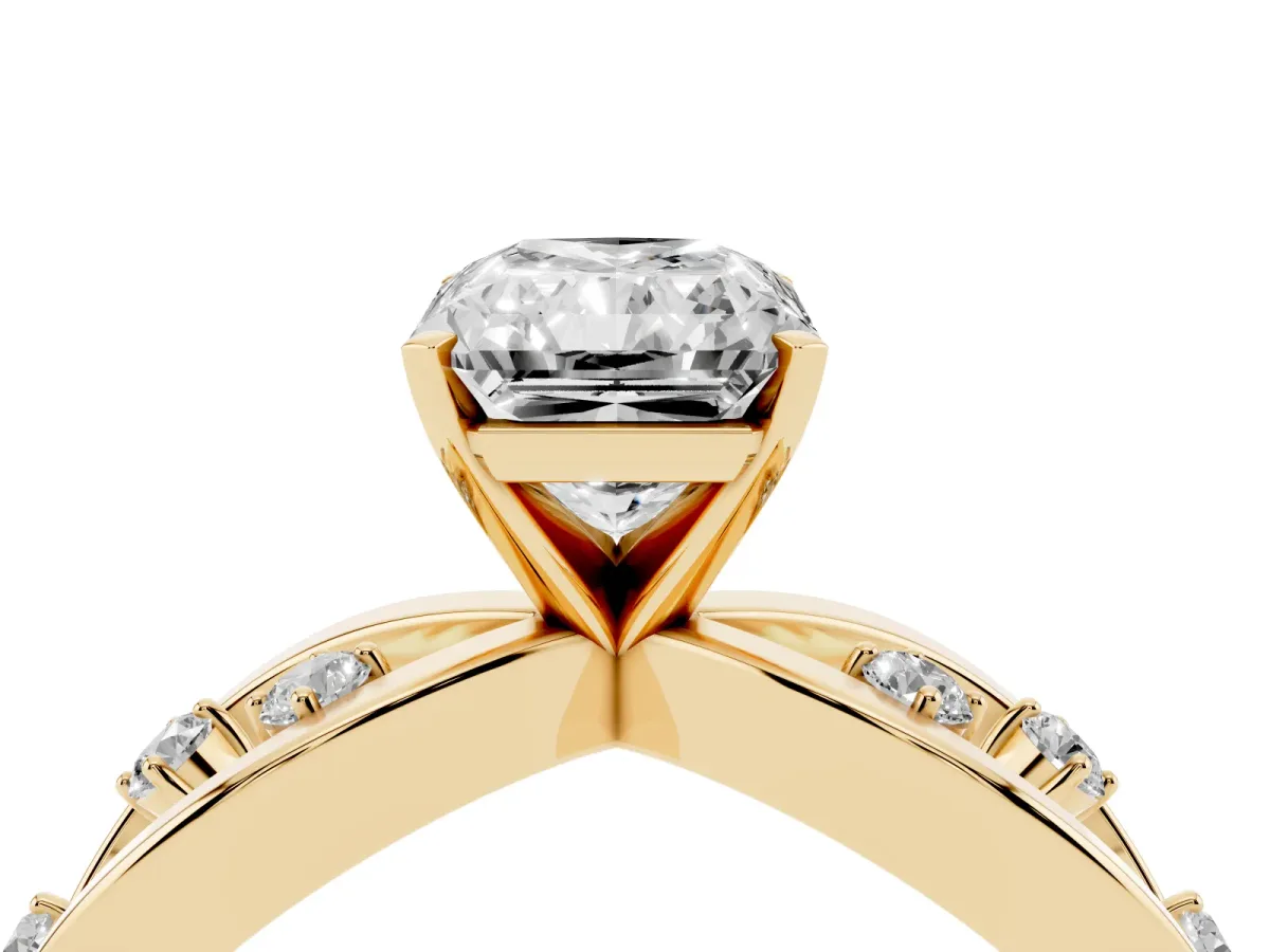 Radiant Cut Cut Solitaire Diamond with Side Stones on Criss-Cross Band and Four-Prong Setting Yellow gold