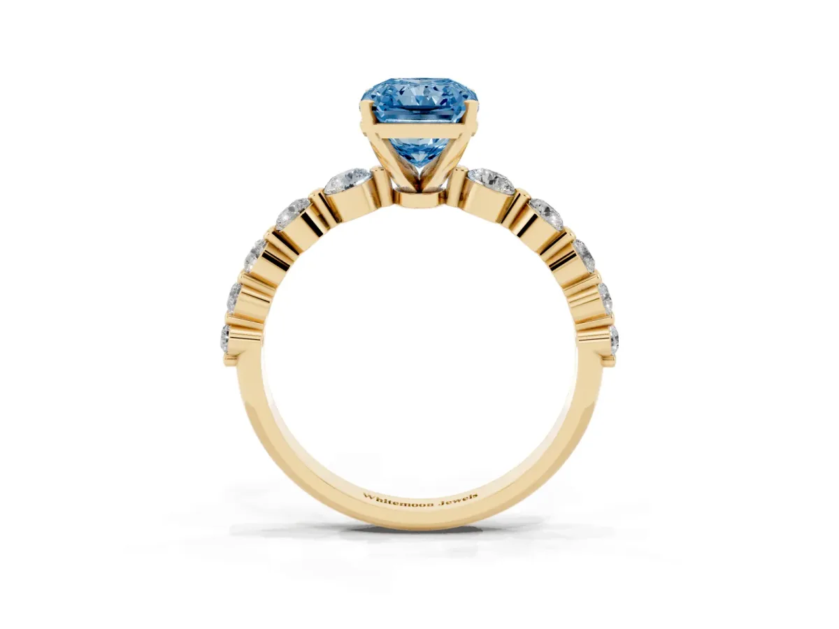 Fancy Blue Radiant Cut Solitaire Diamond Ring with Pave Band and Four-Prong Setting Yellow gold